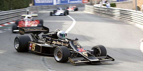 Running at the historic Monaco Grand Prix circuit in the Lotus 77 with a Ferrari 312-T behind.